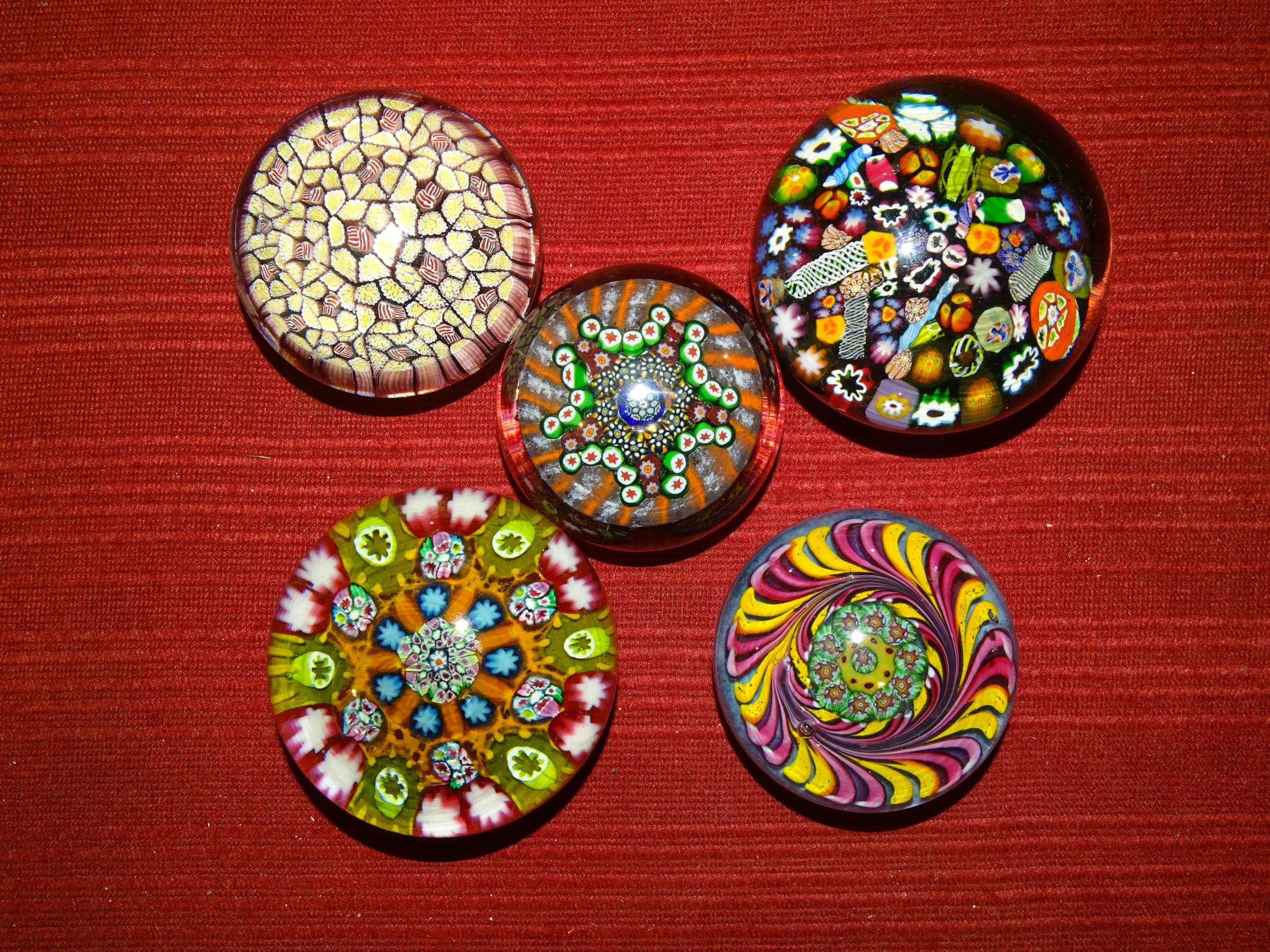A scrambled End of Day and latticino glass paperweight, 9cm diameter, three millefiori and one other