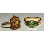 A 9k gold ring set square-cut peridot and a 9ct gold citrine cluster ring, size N½, 7g, (2).