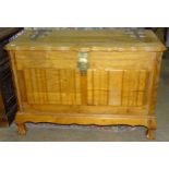 A brass-bound hardwood blanket chest with carrying handles on claw and ball feet, 102cm wide, 69cm