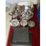 A plated four-piece tea service, entrée dish and other plated ware.