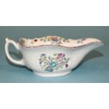 A Worcester moulded famille rose sauce boat, 6cm high, 15cm long, (chip and rim restoration).