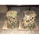 A pair of salt-glazed stoneware garden seats in the form of intertwined roots with oak leaf seat,