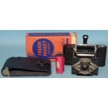 An Ensign Midget camera with instructions, film, leather case and original box.