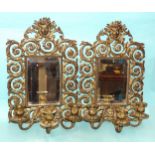 A pair of early-19th century gilt-metal girandole, each of pierced foliate scrolling form,