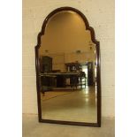 A 19th century rosewood-framed wall mirror, the arched moulded frame with bevelled plate, 109cm x