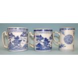 Chinese 18th century, two blue Canton export tankards with crossover handles, 11.5cm and 11cm high