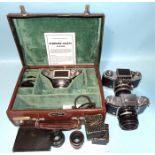 An Ihagee Exakta 127 camera kit with two spare lenses and accessories and two other Exakta SLR