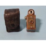 A 1930's Coronet Midget mottled brown Bakelite camera, in case.
