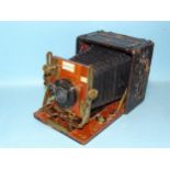 A Sanderson Regular Model hand and stand quarter-plate camera, serial no.22390, black leather