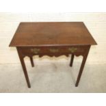 An antique oak side table, having a single frieze drawer, on chamfered legs, 81cm wide, 79cm high.