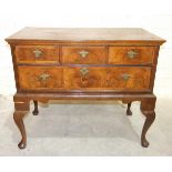 A mainly-18th century walnut feather-banded lowboy fitted with four drawers, on cabriole legs,