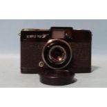 An Olympus-Pen W half-frame wide-angle camera, serial no.106658, with E Zuiko f2.8 25mm lens, (