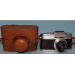 A Wray Wrayflex 35mm SLR camera, serial no.3557, with Unilux f2.8 50mm lens and case, (shutter