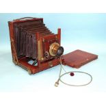A mahogany and brass half-plate field camera, unsigned, with brass lens, (shutter not working), with