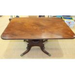An early-19th century mahogany or walnut tilt-top breakfast table, the one-piece rectangular top