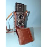 A Rolleiflex 2.8 E2 TLR camera no.2354863, with Carl Zeiss Planar f2.8 80mm lens, in leather case.