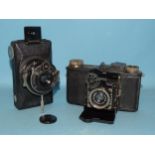 A Zeiss Ikon Super Nettel folding camera with Carl Zeiss Jena Tessar f3.5 5cm lens and a Zeiss