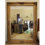 A very large modern gilt-framed mirror, 220 x 158cm, (mirror detached for storage and transport).