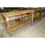 A modern stained wood kitchen centre work table with four through-sliding drawers, the two-part