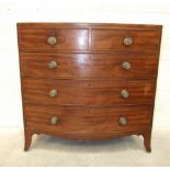 An early-19th century mahogany bow-front chest of two short and three long drawers, on bracket feet,