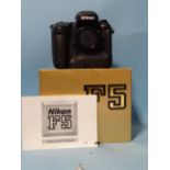 A Nikon F5 camera body, (boxed, with manual).