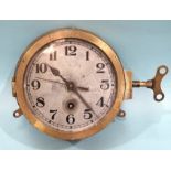 A WWII German Kriegsmarine brass bulkhead clock, the silvered dial with Arabic numerals, Slow/