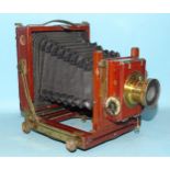 A mahogany and brass quarter-plate camera, with Thornton Pickard shutter and lens.