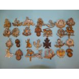 A collection of twenty-eight various military badges, including Bedfordshire, Lincolnshire, East