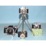 An Eljy Lumiere sub-miniature camera, a Japanese Mycro camera on tripod, a Japanese "Hit" camera