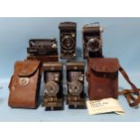 An Ensign Selfix 820 folding camera, with Ross Xpres f3.8 105mm lens, instructions and case, three