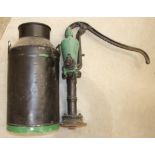 A cast iron mechanical water pump and a painted metal milk churn marked Torrington, (2).