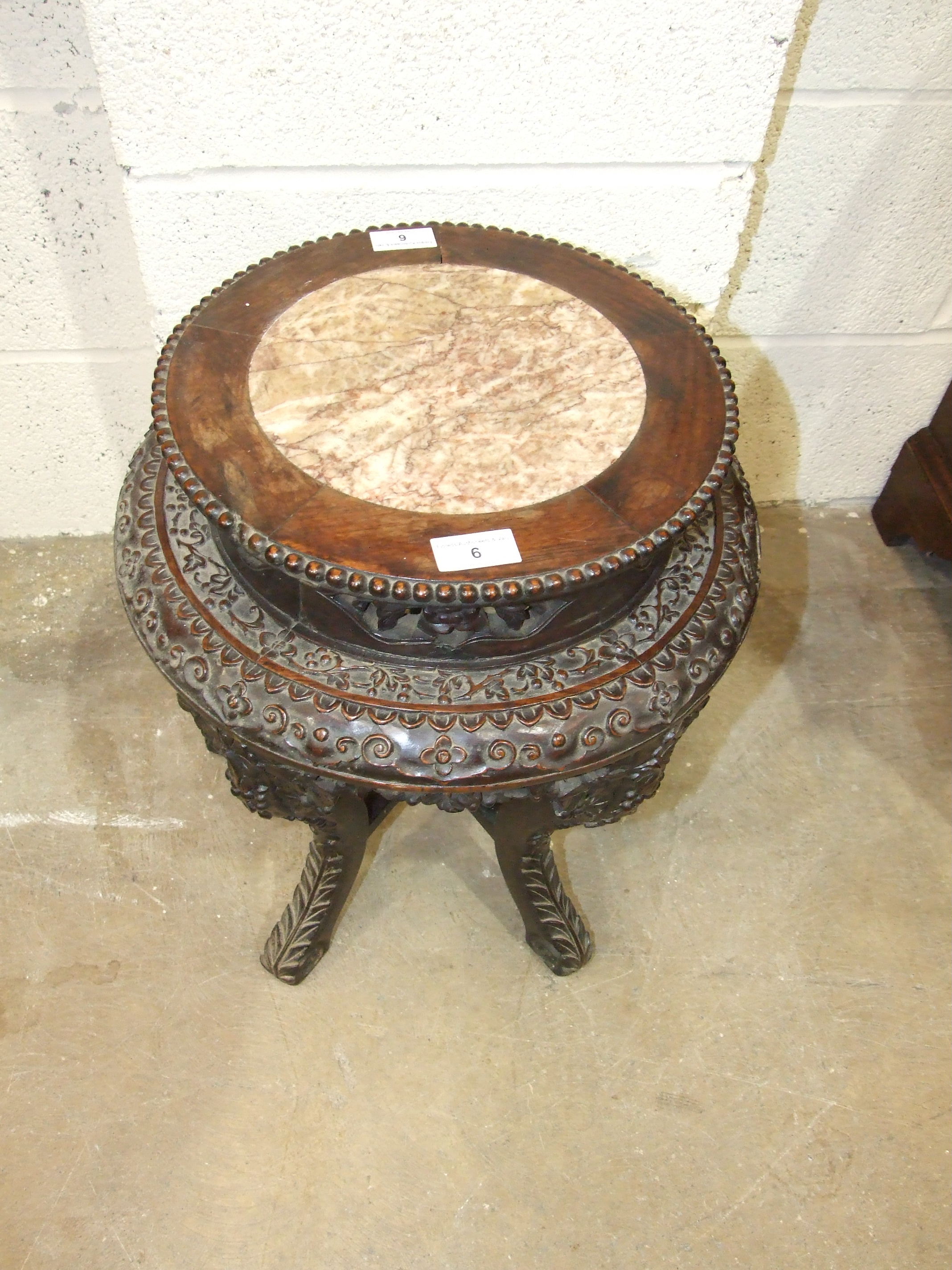 A Chinese carved hardwood plant stand with raised inset marble top, on five shaped and carved - Image 5 of 5