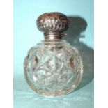 A silver-top cut-glass scent bottle with stopper, Walker & Hall, Chester 1907, 10.5cm high.