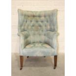 A late-Victorian tub-shaped wing armchair with button back, on square tapered legs, 110cm high, 42cm