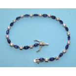 A 9ct white gold bracelet set blue and white synthetic stones, 19cm long, 7.5g.