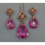 A pink sapphire and diamond pendant and matching earrings, each set briolet-cut sapphire drop