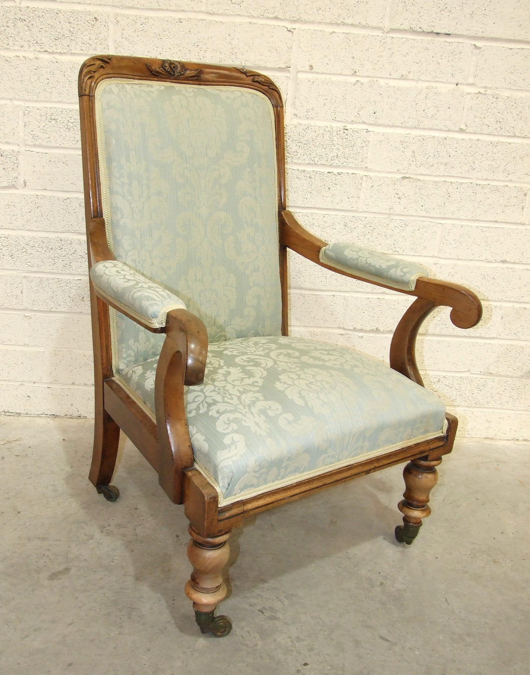 A 19th century walnut salon chair, the rectangular back with upholstered centre and open arms, the