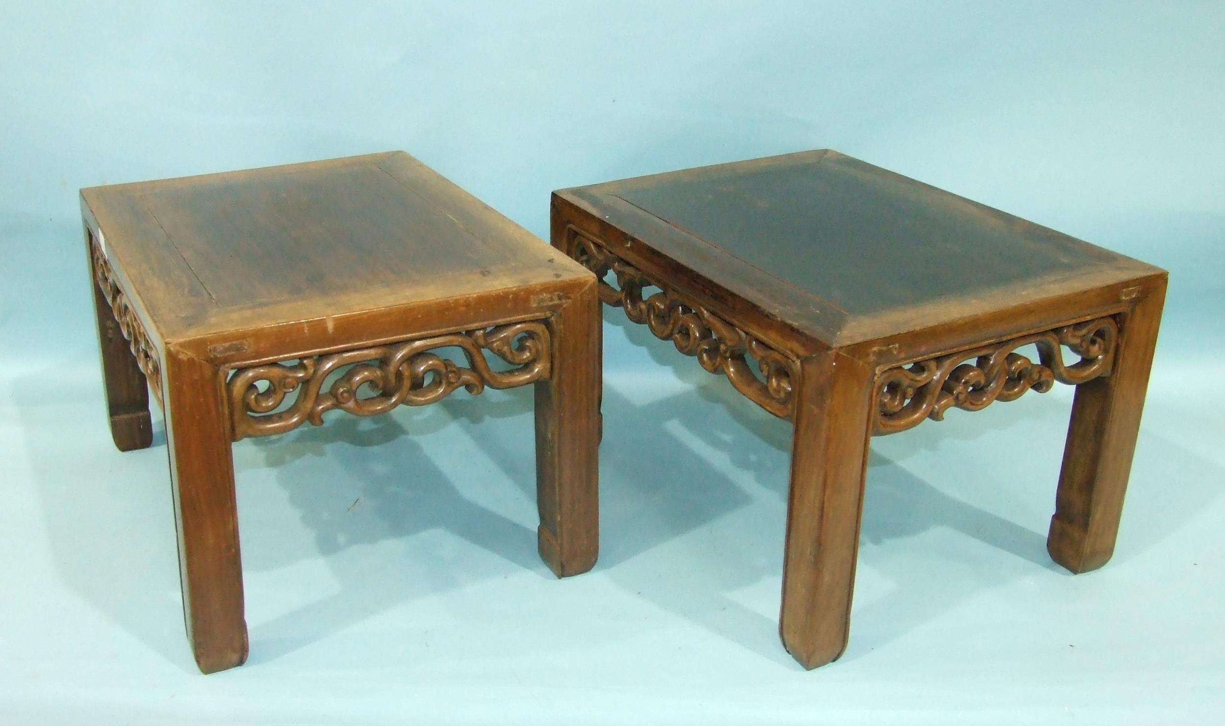 A pair of Chinese hardwood rectangular low occasional tables with pierced frieze, on square shaped