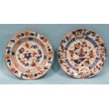 A pair of 19th century Chinese plates decorated with flowers in Imari colours, 22.5cm diameter, (2).