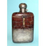 An Edwardian silver hip flask with a glass moulded body and 'crocodile skin' leather top, the