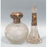 A silver-topped cut-glass scent bottle, (no stopper), Birmingham 1901, 12.5cm high and another of