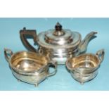 A George V silver three-piece tea service with gadrooned rim by Goldsmiths and Silversmiths Co,