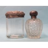 A silver-topped cut-glass scent bottle with stopper, Birmingham 1908, 10cm high and a silver-