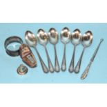 A set of six silver teaspoons, Sheffield 1931, a silver napkin ring, a cased silver thimble and a