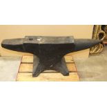 A large vintage cast iron blacksmith's anvil, 95cm long, 32cm high.