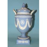 A Wedgwood Etruria jasperware urn-shaped vase and cover decorated in the classical style with