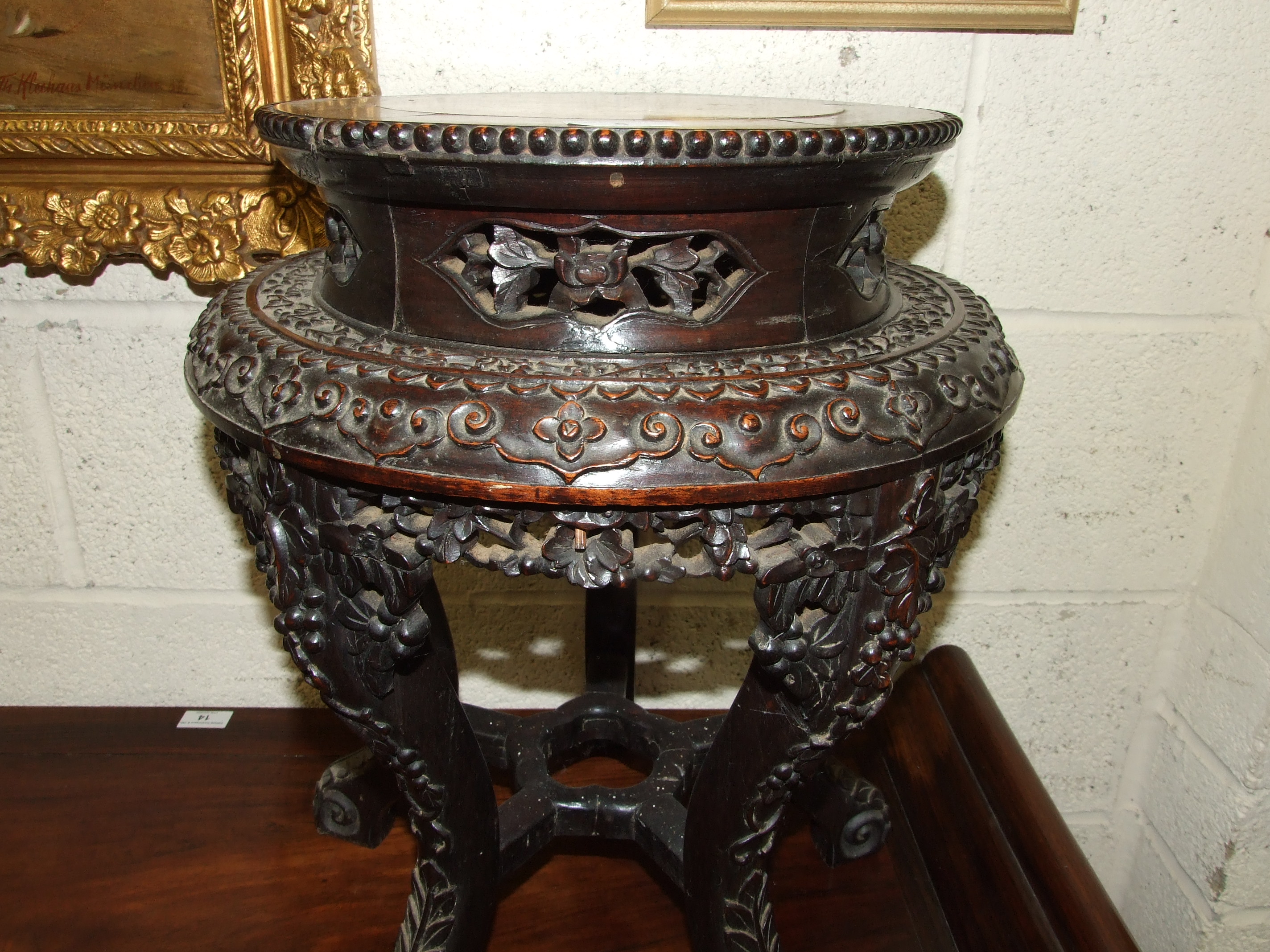 A Chinese carved hardwood plant stand with raised inset marble top, on five shaped and carved - Image 3 of 5