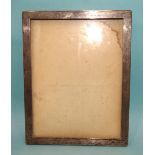 A silver rectangular photograph frame of plain form, 23 x 18cm, (marks rubbed).