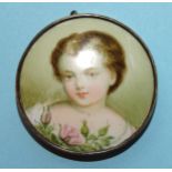 A Victorian silver-mounted brooch with hand-painted portrait of a young girl with roses, on