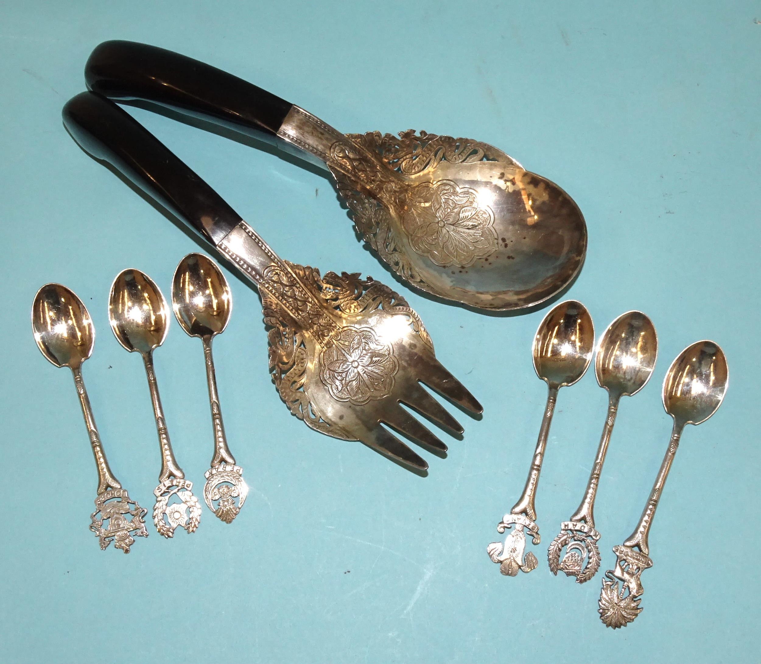 A pair of Malaysian white metal horn-handled salad servers with floral and leaf decoration and six